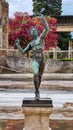 POMPEII, ITALY, JULY 19, 2021: Bronze statue of the dancing Faun at the House of the Faun in Pompeii