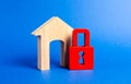 House figurine with large doorway and red padlock. Security and safety. Confiscation for debts. alarm system. seizure of property Royalty Free Stock Photo