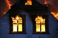 House in flames burning down. Fireblaze.