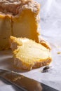 House fly attracted by cheese feeding beside a slice of Langres Royalty Free Stock Photo