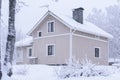 The house in the forest has covered with heavy snow and bad sky in winter season at Tuupovaara, Finland Royalty Free Stock Photo