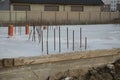 House foundation made from concrete shuttering blocks filled with mortar and reinforcement bars