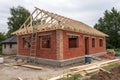 House frame with red bricks at construction site Royalty Free Stock Photo