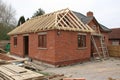 House frame with red bricks at construction site Royalty Free Stock Photo