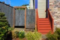 House Frontyard with Wood Stairs and Fence