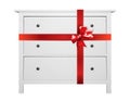 House furniture - Modern white commode gift tied red bow. Isolated Royalty Free Stock Photo
