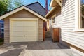 House and garage in clapboard siding trim