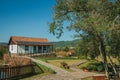 House with garden amid rural landscape Royalty Free Stock Photo