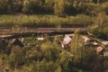 House with the garden near railway lines. wooden house in the forest aerial. rural landscape