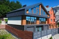 House with a gray metal roof and large windows on the facade. Co Royalty Free Stock Photo