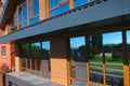 House with a gray metal roof and large windows on the facade. Co Royalty Free Stock Photo