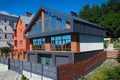 House with a gray metal roof and large windows on the facade. Co Royalty Free Stock Photo