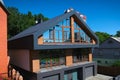 House with a gray metal roof and large windows on the facade. Co Royalty Free Stock Photo