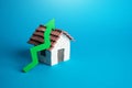 House and green arrow up. Rising housing prices.d, Royalty Free Stock Photo