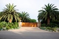 House with green lawn manicured frontyard garden in suburban residential neighborhood Royalty Free Stock Photo