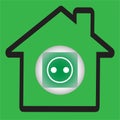 Silhouette of a house with a green power socket button Royalty Free Stock Photo