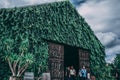 House with green vines covered at The birder`s Lodge farmer`s market in Khao Yai