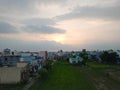 House, greenery, sky and clouds landscape view