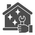 House and hand with wrench solid icon, Home professional services concept, Maintenance house sign on white background Royalty Free Stock Photo