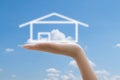 House in hands and blue sky Royalty Free Stock Photo