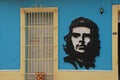 Art of Che Guevara on a blue colonial style house along a street at Trinidad, Cuba