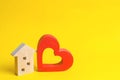 House with a heart. House of lovers. Affordable housing for young families. Accommodation for lovers of couples. Valentine`s day. Royalty Free Stock Photo