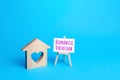 House with a heart and an romantic vacation easel. Choosing a place for a trip. Affordable cheap housing for young couples and Royalty Free Stock Photo