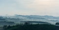 House on hill. Mountain farm house with foggy valley and distant mountains on horizon. Wonderful nature scenery of thailand Royalty Free Stock Photo