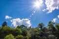 House on the hill. Sunny dav, blue sky, white clouds