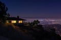 house on a hilltop, city lights in the distant night Royalty Free Stock Photo