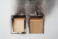 House or home fire - boarded up windows and burned apartment building facade blackened by soot Royalty Free Stock Photo