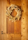 House home front door Fall autumn Thanksgiving decorations country style natural botanical rustic wreath on wood background