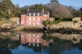 House in the Ile-aux-Moines. Morbihan Gulf with reflections in t