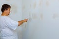 house improvements. putting plaster on the wall with spatula Royalty Free Stock Photo