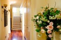 House interior. Hallway with rose buquet