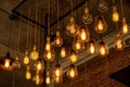 Beautiful vintage luxury light bulb hanging decor glowing in dark. Royalty Free Stock Photo