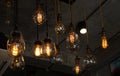 Beautiful vintage luxury light bulb hanging decor glowing in dark Royalty Free Stock Photo