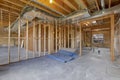 House interior under construction with air conditioning ducts on the ceiling