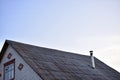 The house with an iron chimney pipe furnace Royalty Free Stock Photo