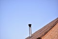 The house with an iron chimney pipe furnace Royalty Free Stock Photo