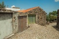 House with iron garage gate on cobblestone alley