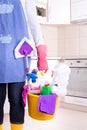 House keeper with cleaning equipment in bucket