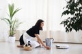 House keeping concept. Woman wiping floor. Woman doing chores at home. Royalty Free Stock Photo