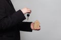 House key in hand of business person. Hand holding a key and house Royalty Free Stock Photo