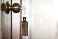 House key with home keyring in keyhole, property concept Royalty Free Stock Photo