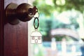 House key with home keyring in keyhole, property concept Royalty Free Stock Photo