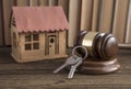 House, key, judge hammer on a books background. Royalty Free Stock Photo