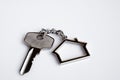 House key ring with antique key on white background. Property investment. Home finance concept Royalty Free Stock Photo