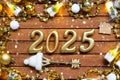 House key with tiny figure of home mock up on festive brown wooden background, lights of garlands. New Year 2025 wooden letters,