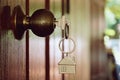 House key in wooden front door Royalty Free Stock Photo